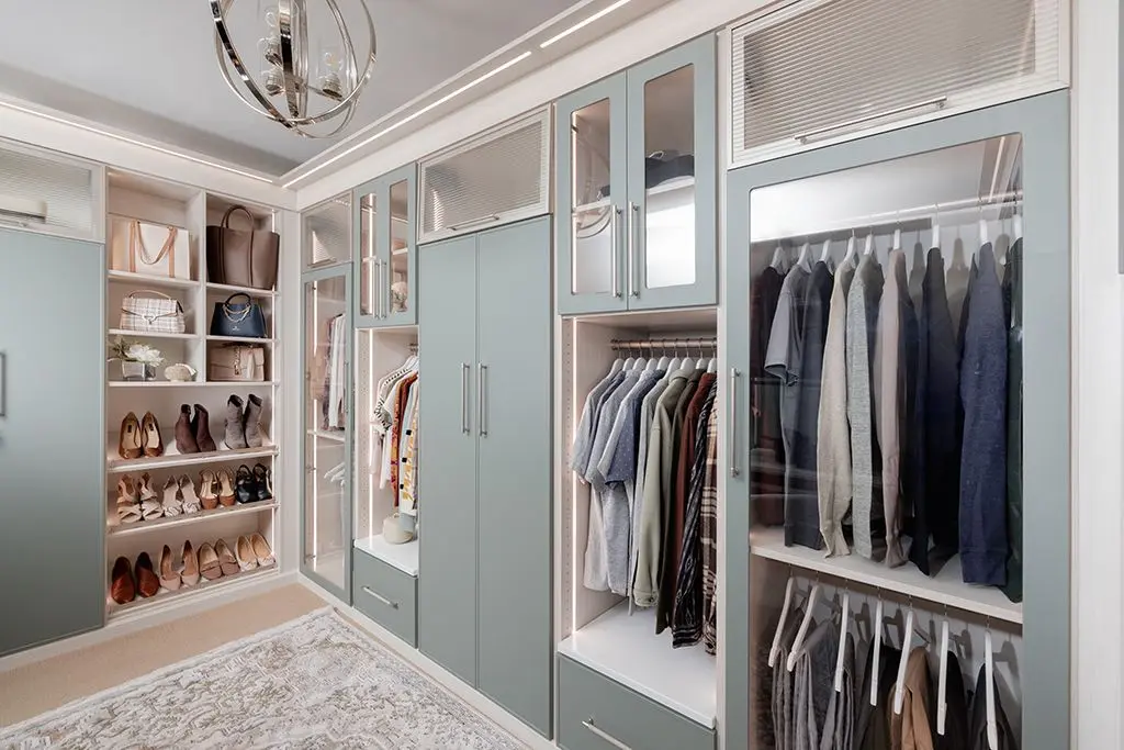 Spacious corner walk in closet organizer setup for dress and apparel storage
