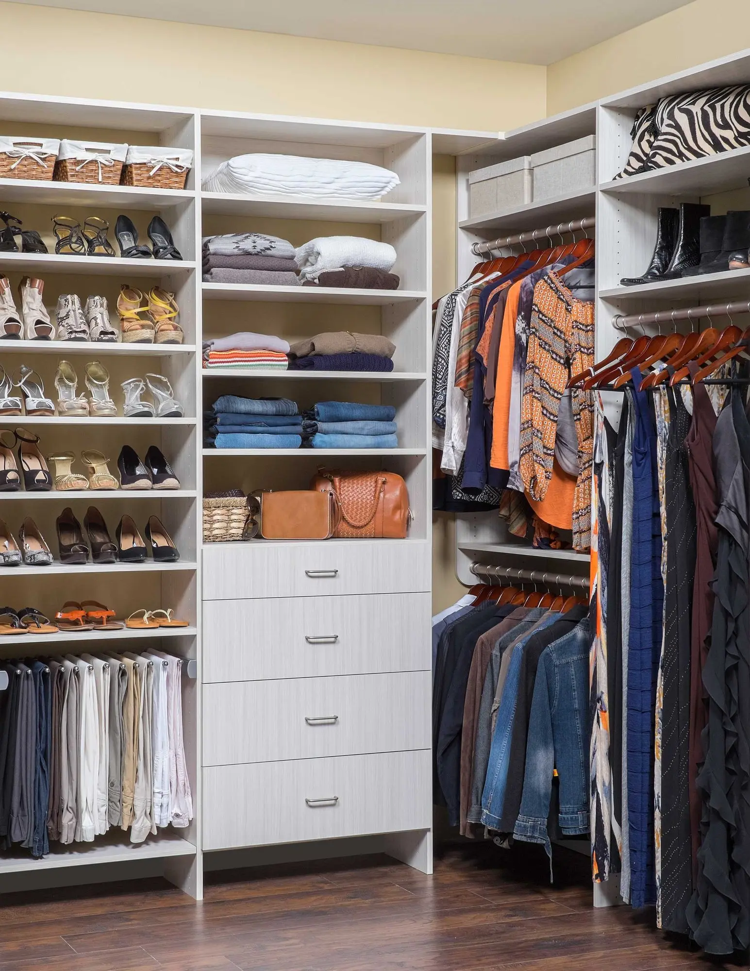 Custom closets Broward County FL design showcasing ample shoe racks and hanging rod space