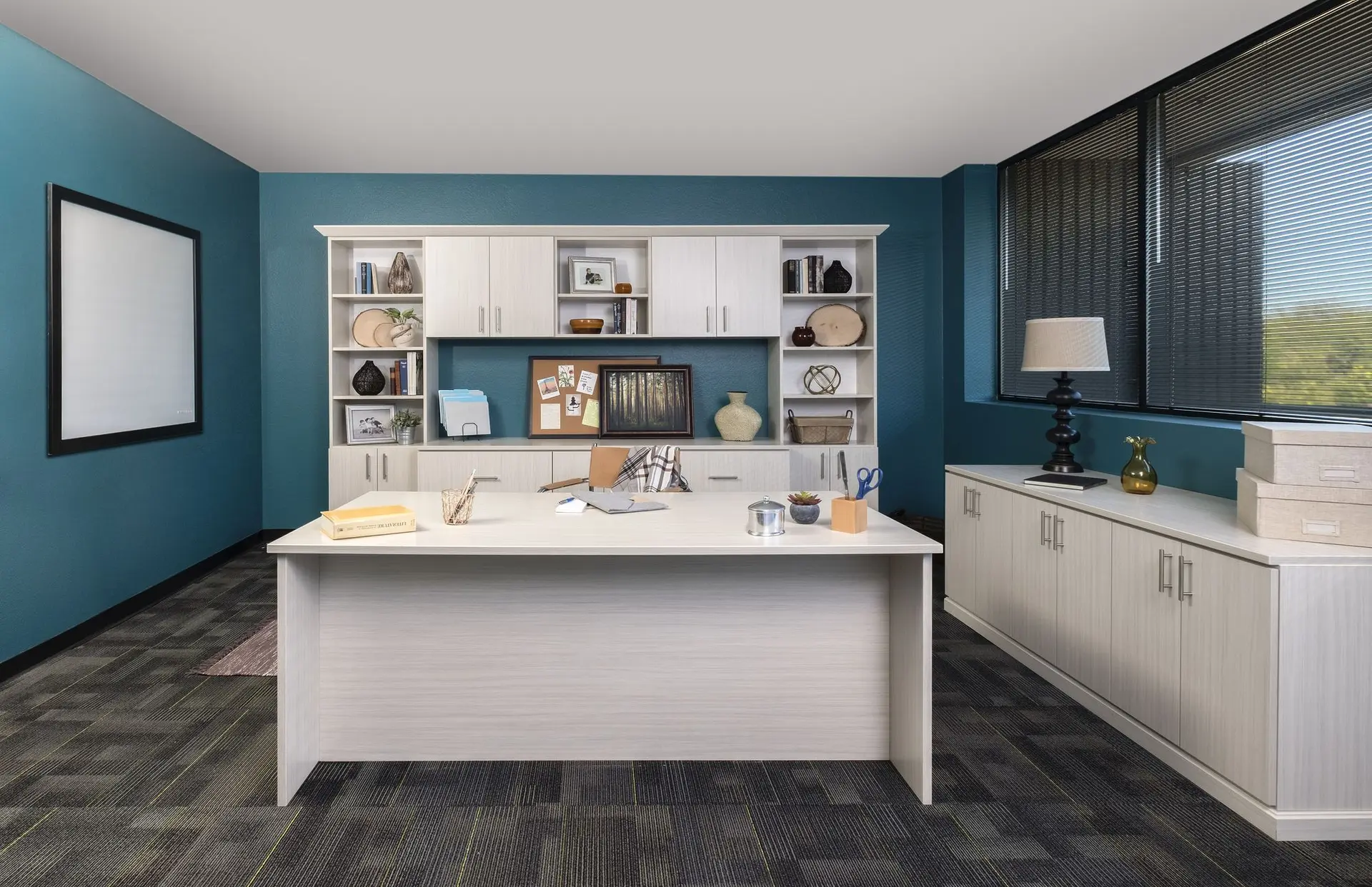 Modern arctic white custom home office desk and open upper shelves with books
