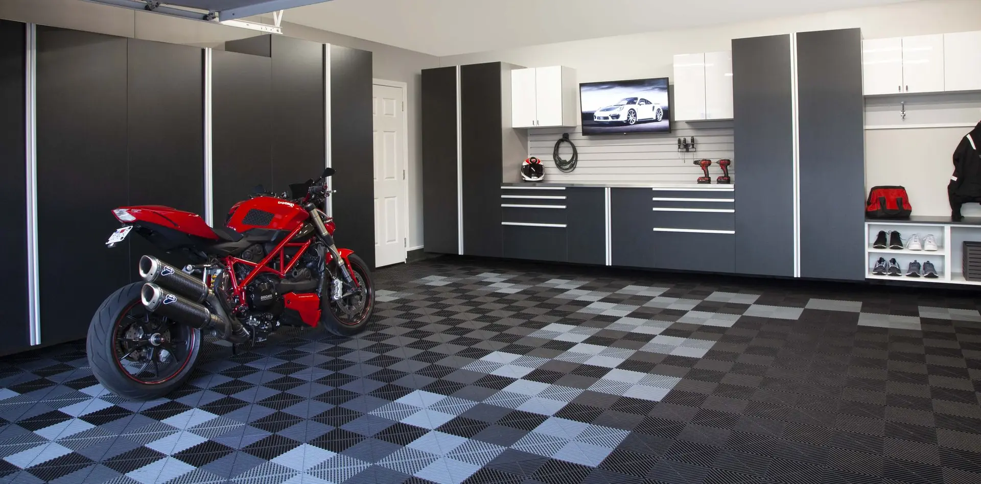 Tall basalt garage closets providing clean organized storage for residential spaces