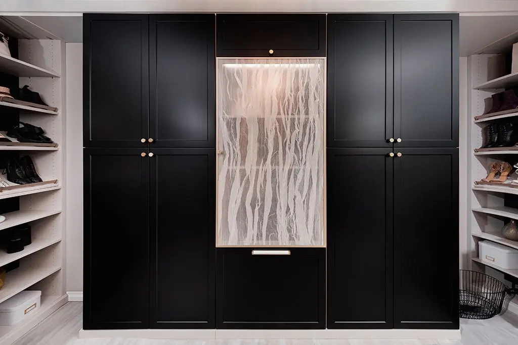 Bespoke black walk in closet systems near me installed in a luxury Weston home