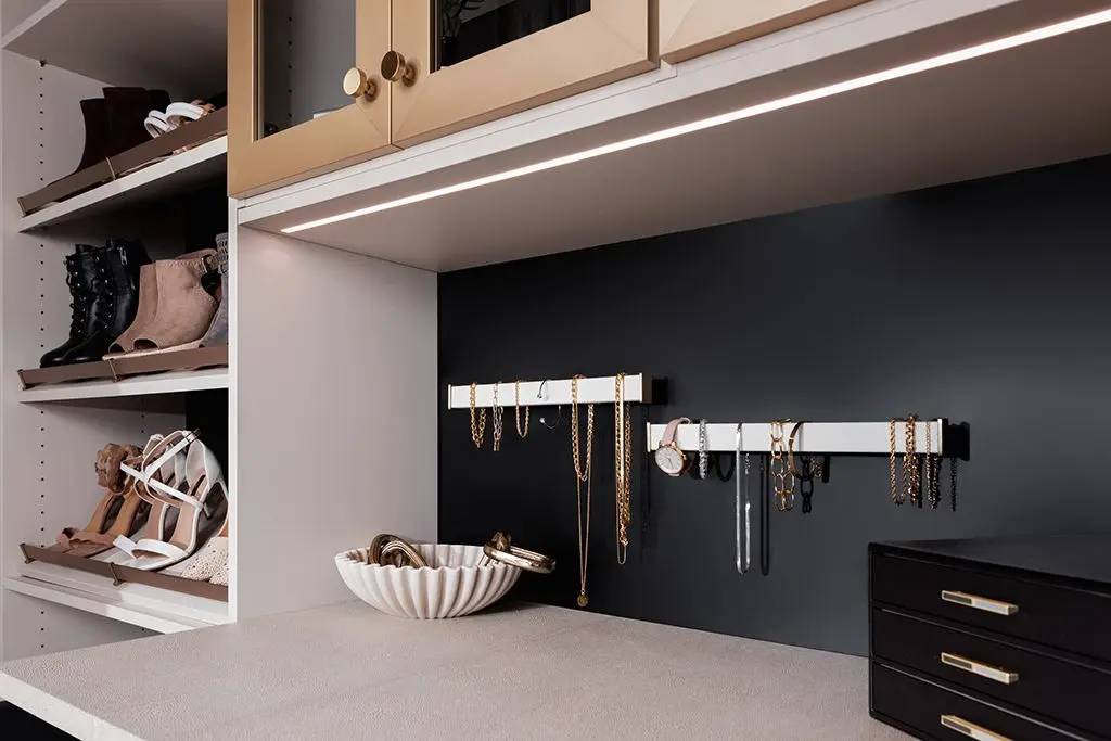 Custom closet organizer system with dark vintage cabinetry built in Fort Lauderdale