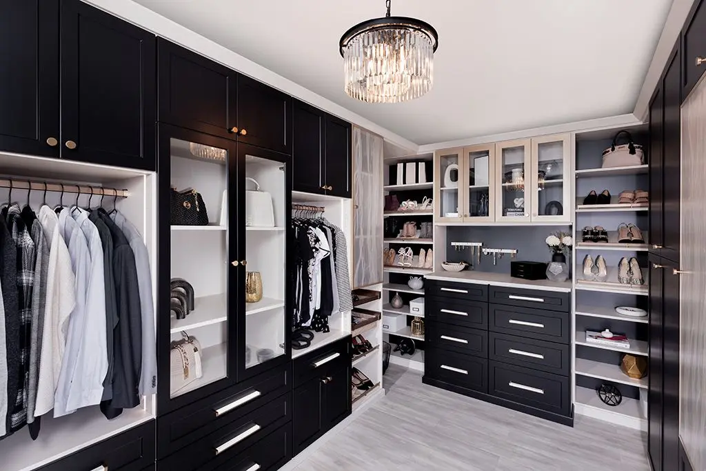 High end boutique walk in closet design Weston layout with custom wardrobe hanging rods