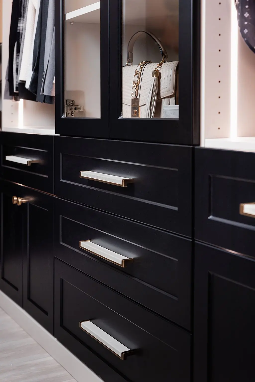 Luxury dark wood closet designer near me setup for master bedrooms in Coral Ridge Isles