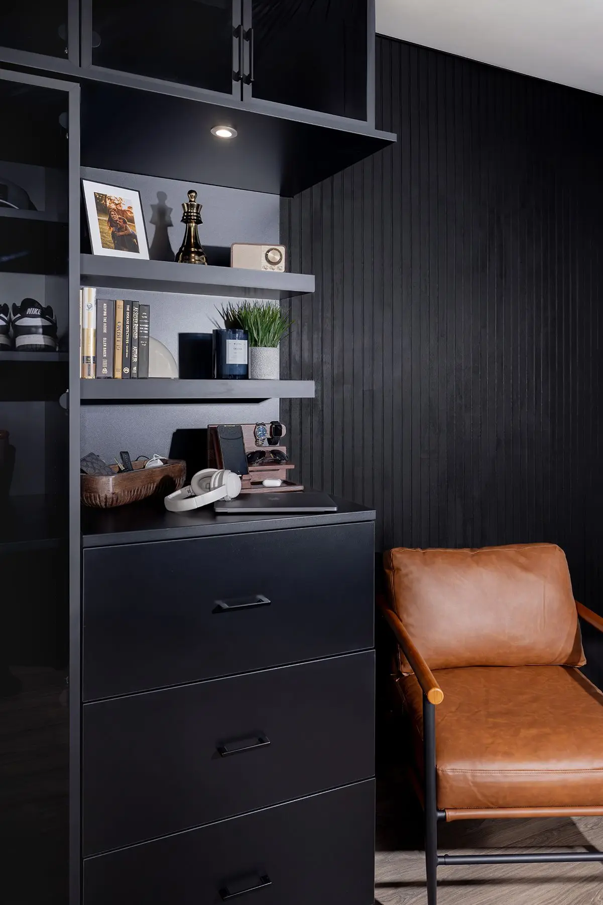 Custom black walk in wardrobe closet with built in led accent lighting