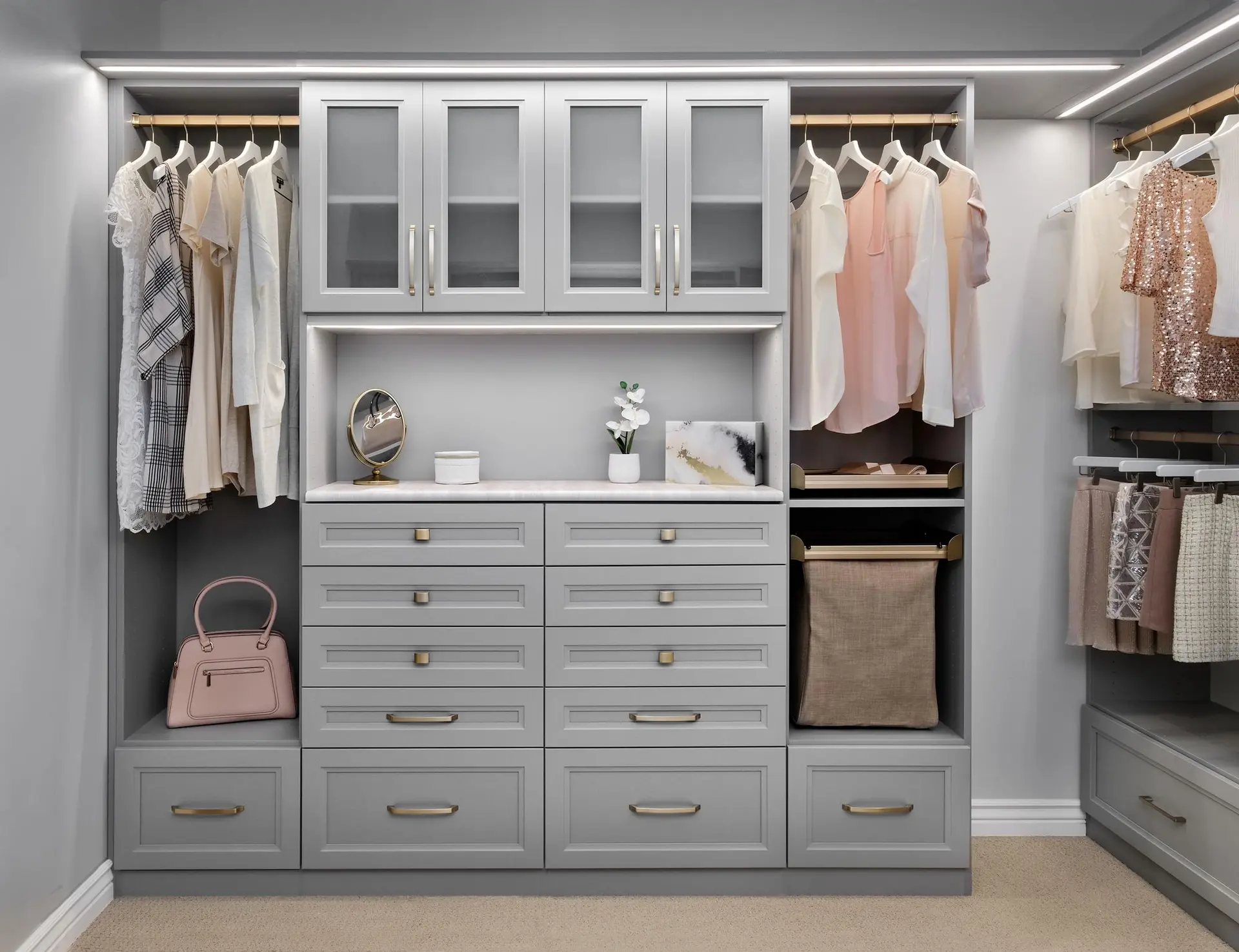 Bright modern custom closets Broward County FL setup with built-in drawers and hanging rods