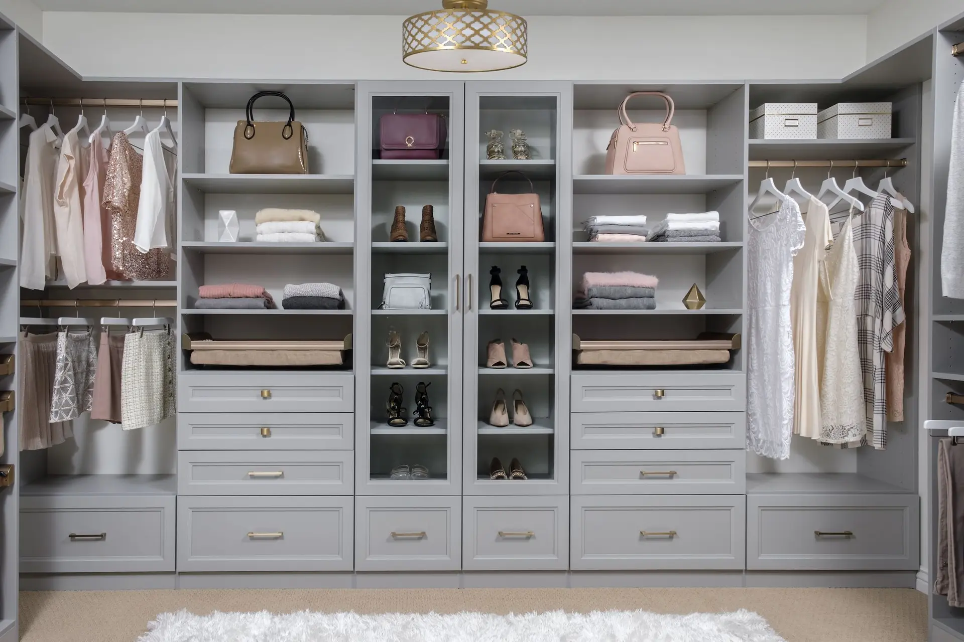 Spacious white walk-in closet systems built by local contractor in Parkland FL
