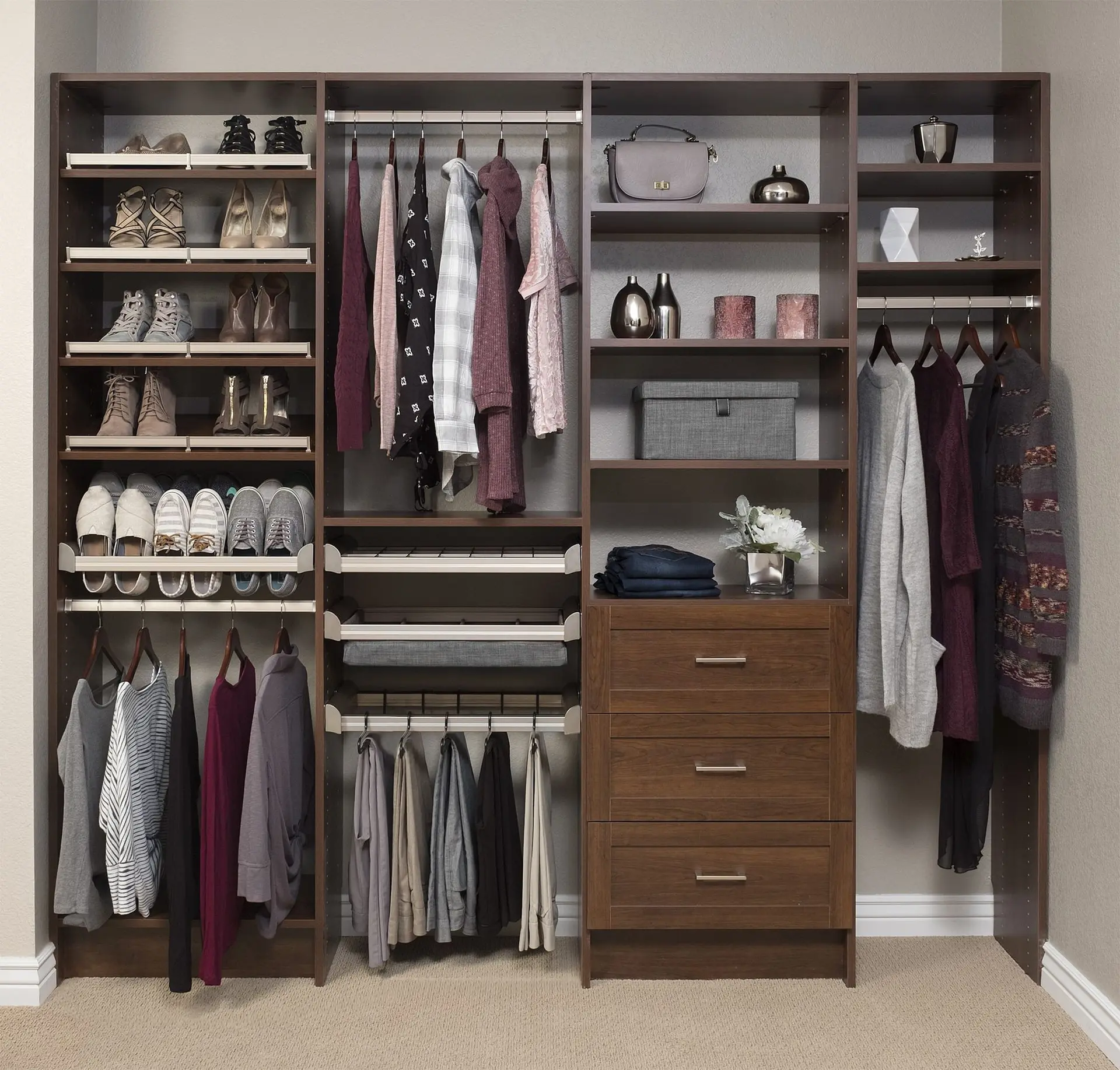 Luxury dark wood closet organizer system maximizing small reach-in storage footprint in Pompano Beach