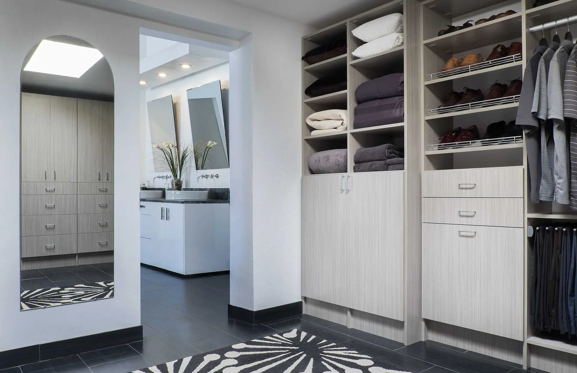 Modern textured concrete grey laminate custom closet systems built by a local contractor in Parkland FL