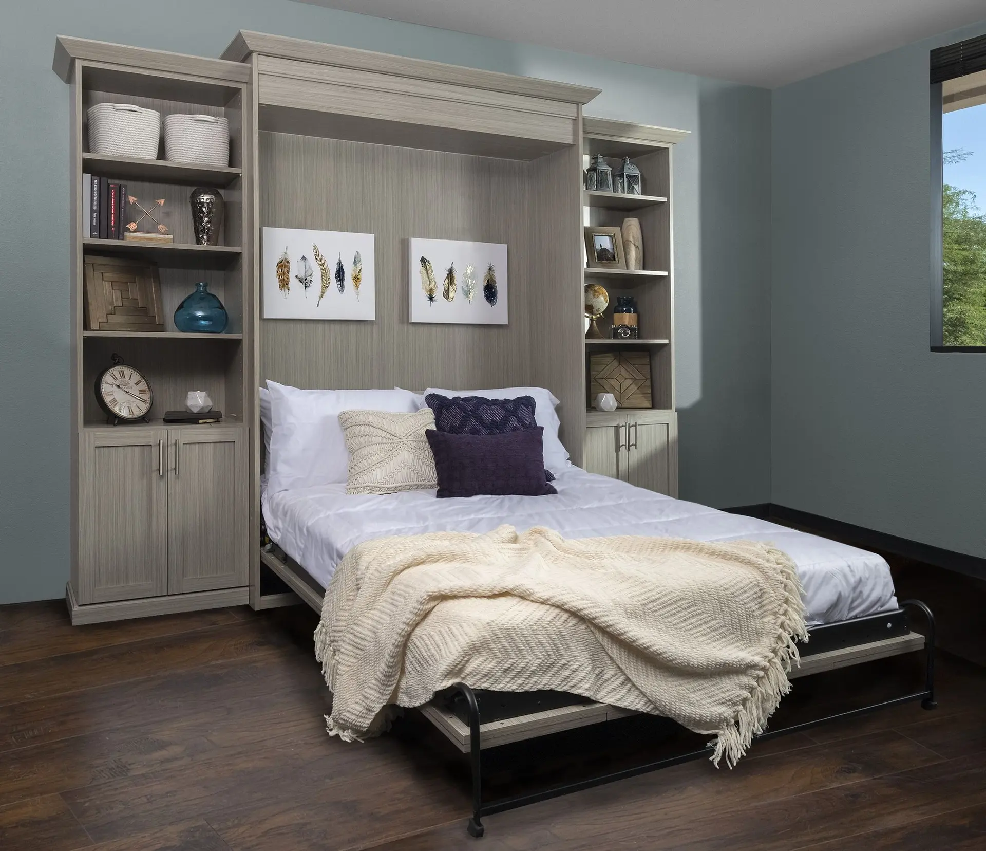 Modern concrete wall bed system custom installed in a luxury master bedroom