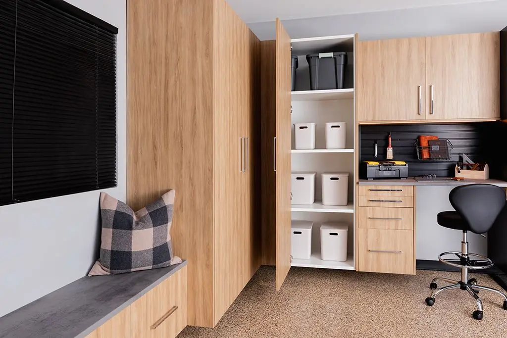 Sleek wood grain garage cabinetry featuring modern long metallic handles