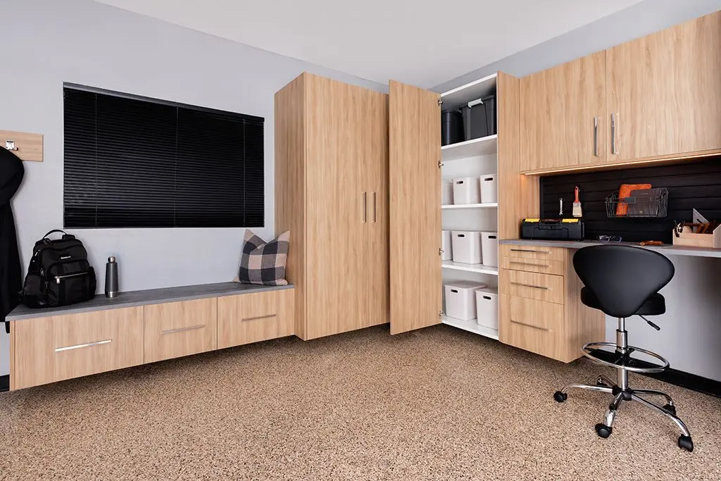 Close up view of clean wood look custom garage storage shelves and drawers