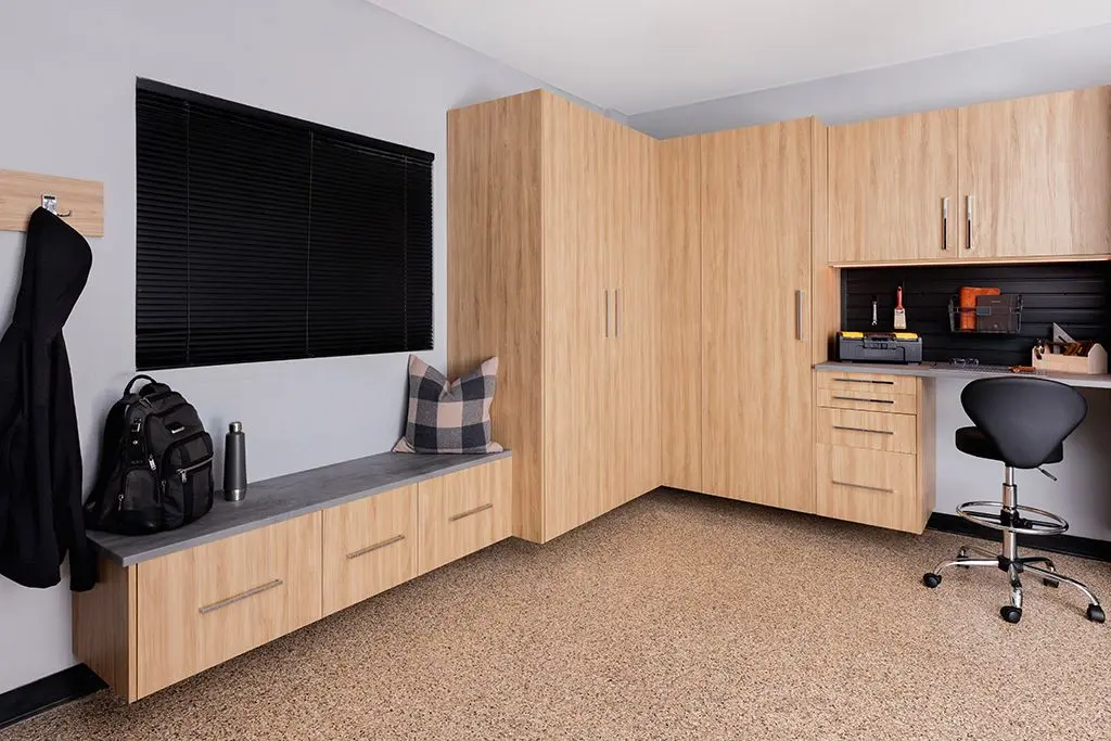 Custom Dakota finish garage cabinetry and tool organization system in Weston