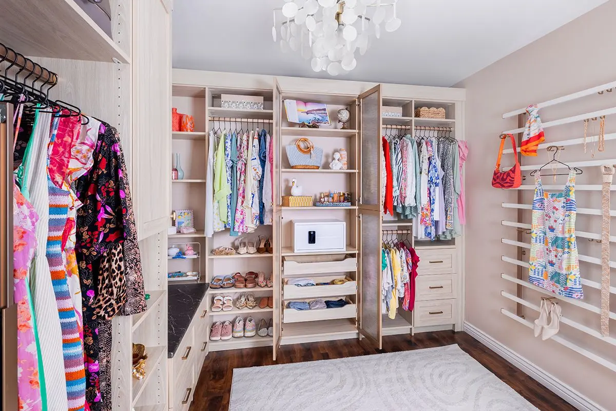 Custom wardrobe storage configuration with spacious overhead cabinet units