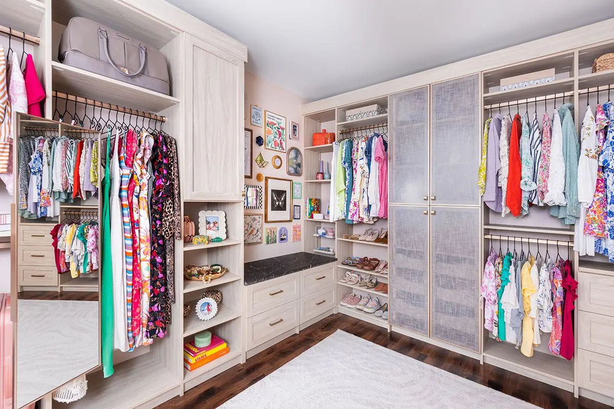 Sophisticated walk-in wardrobe configuration showcasing a clean layout finish