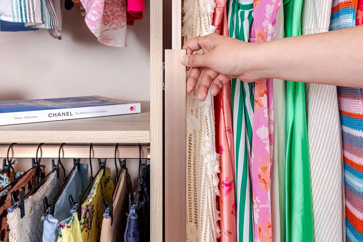 Luxury walk-in closet design featuring a contemporary multi-level dress rack