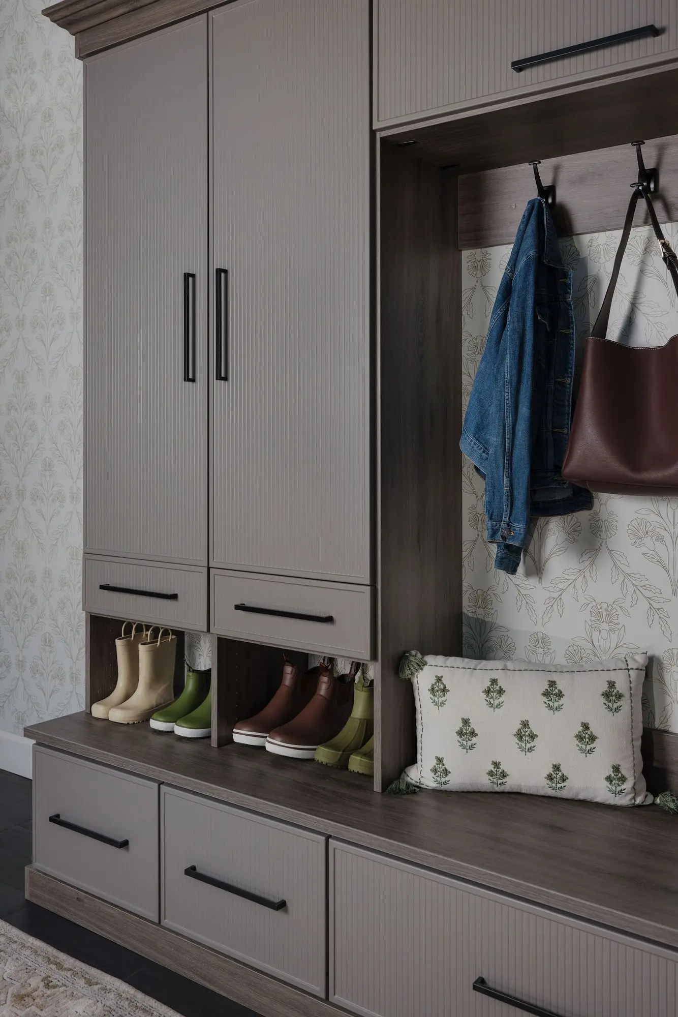 Bespoke entryway drop zone with falcon gray cabinets and open shoe storage shelves