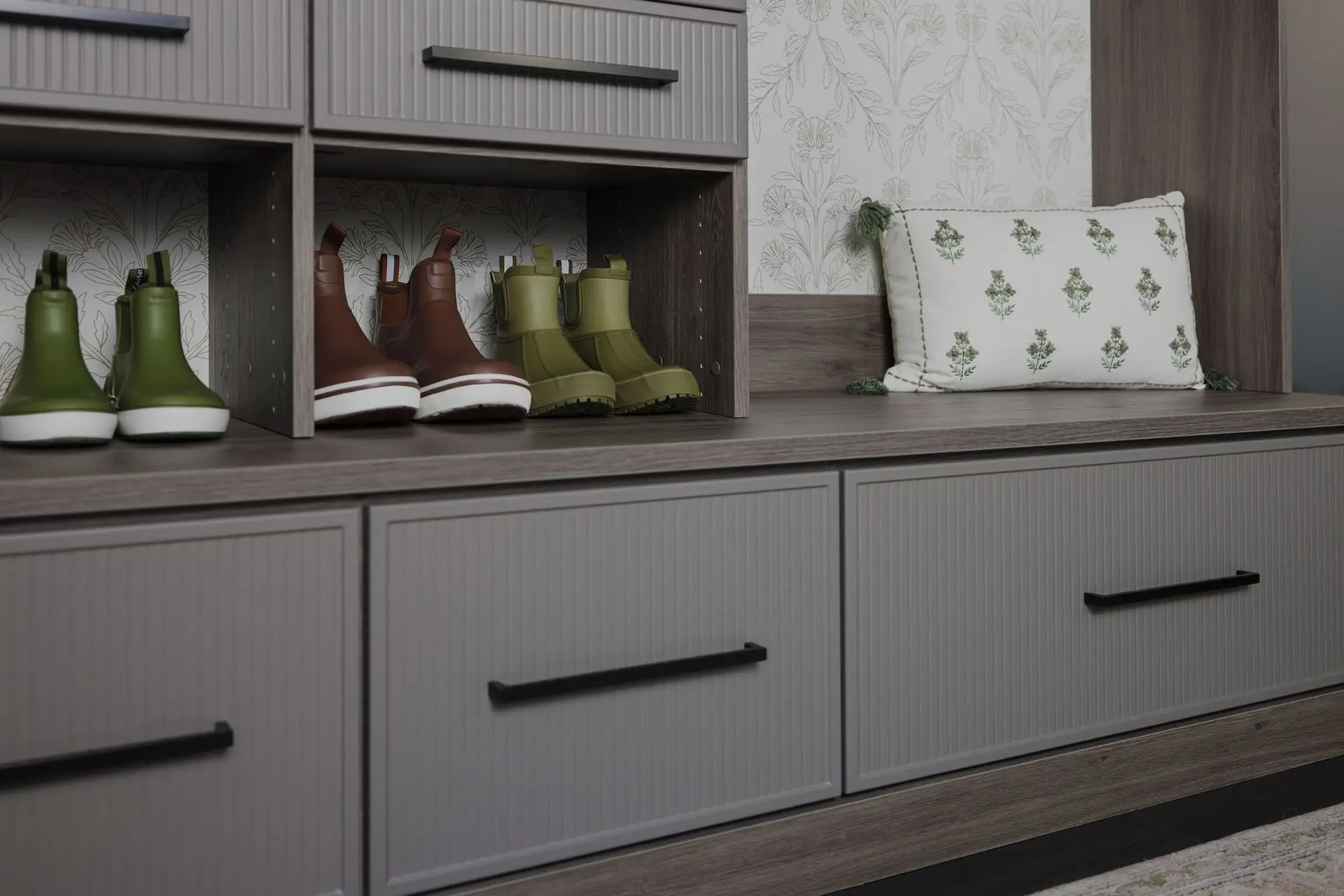 Sleek minimalist ash and grey mudroom storage systems built for a South Florida residence