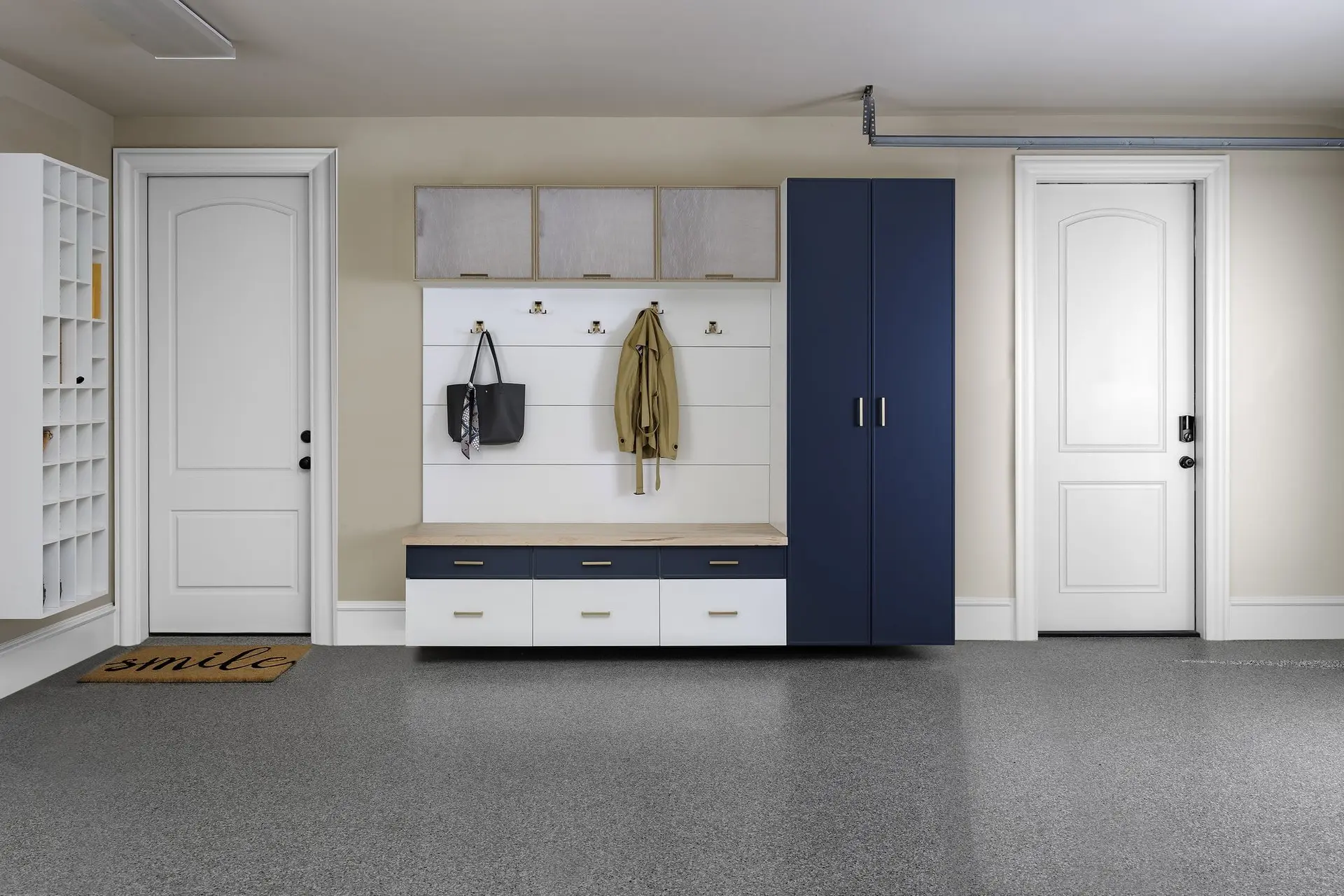 Modern galaxy blue and white mudroom custom built with a benchtop and floating shelves