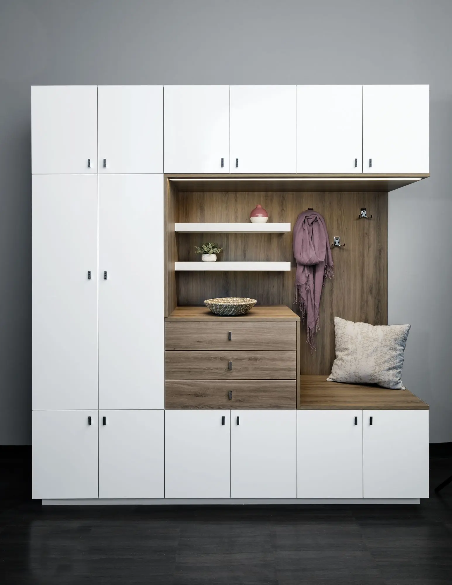 Clean drift and white custom mudroom seating bench with polished chrome hardware