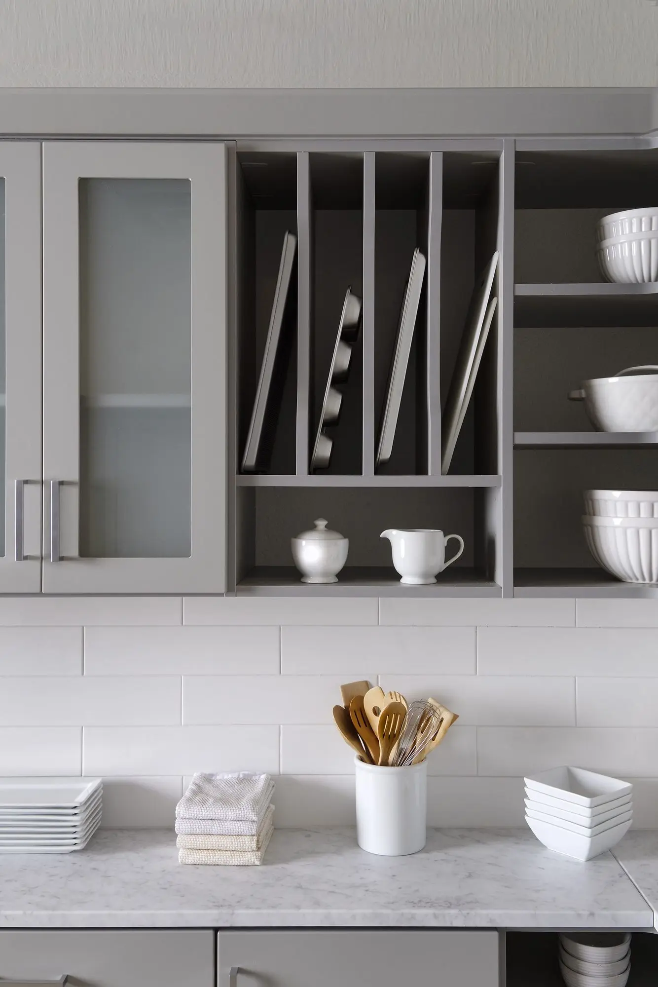 Bespoke pantry organization units with pull out wire baskets and vertical tray dividers