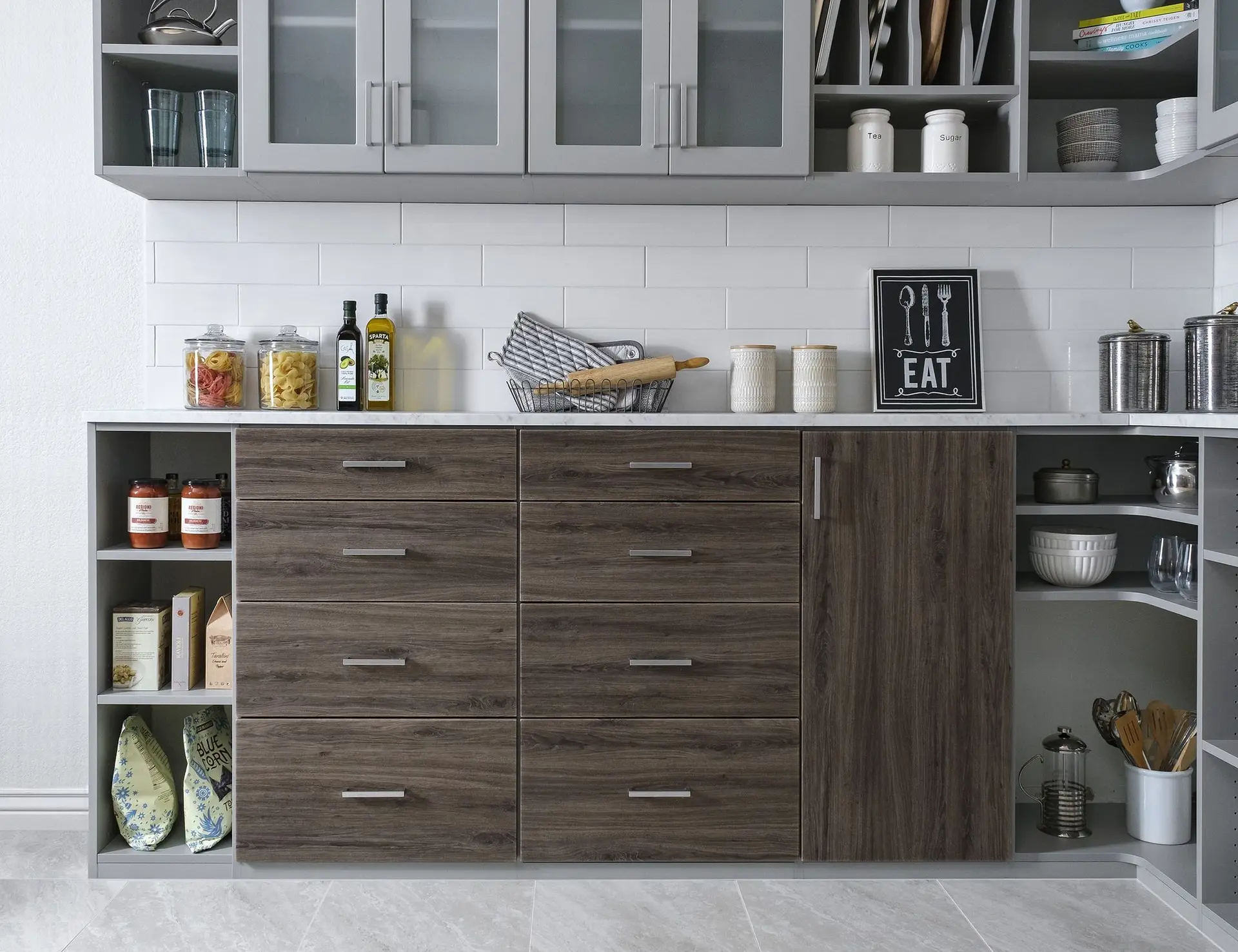 Sleek contemporary custom pantry cabinetry maximizing small kitchen storage spaces