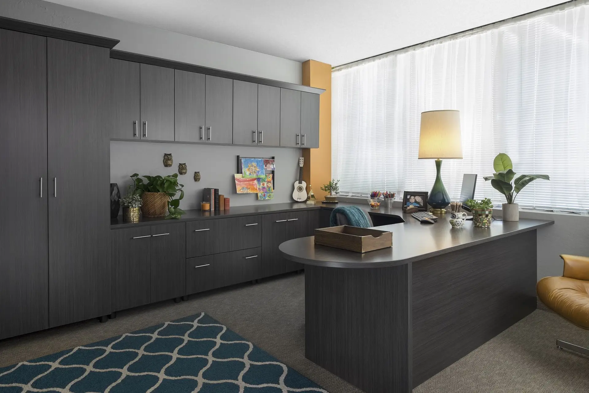 Licorice finish custom home office storage cabinets with wrap around workstation and upper shelving