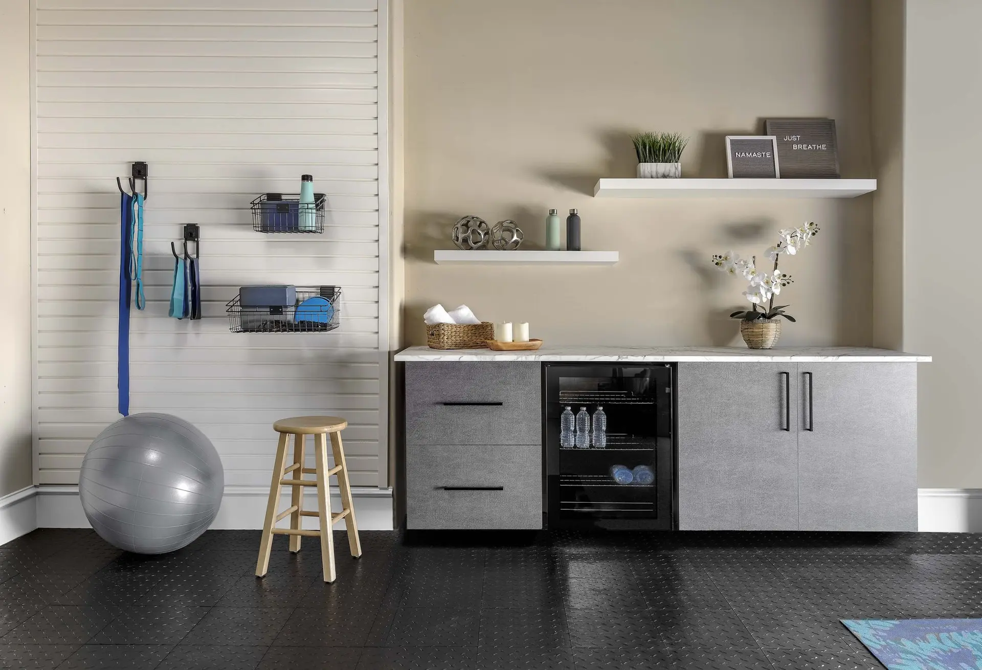 Pewter garage workbench paired with an organized wall tracking system for tools