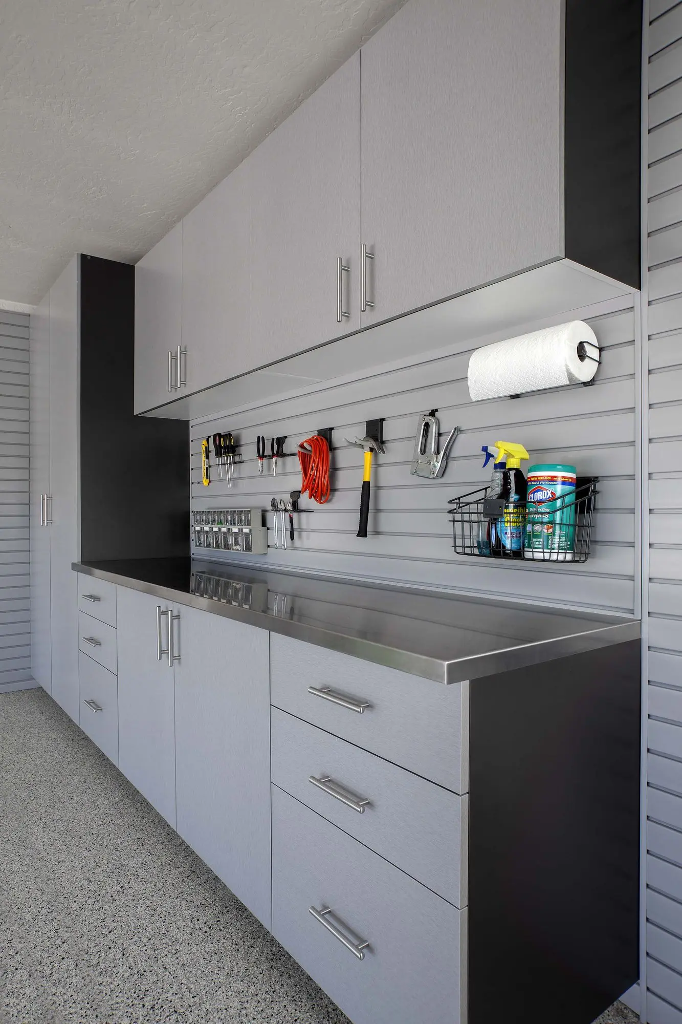Corner view of modern silver garage closets with integrated handles