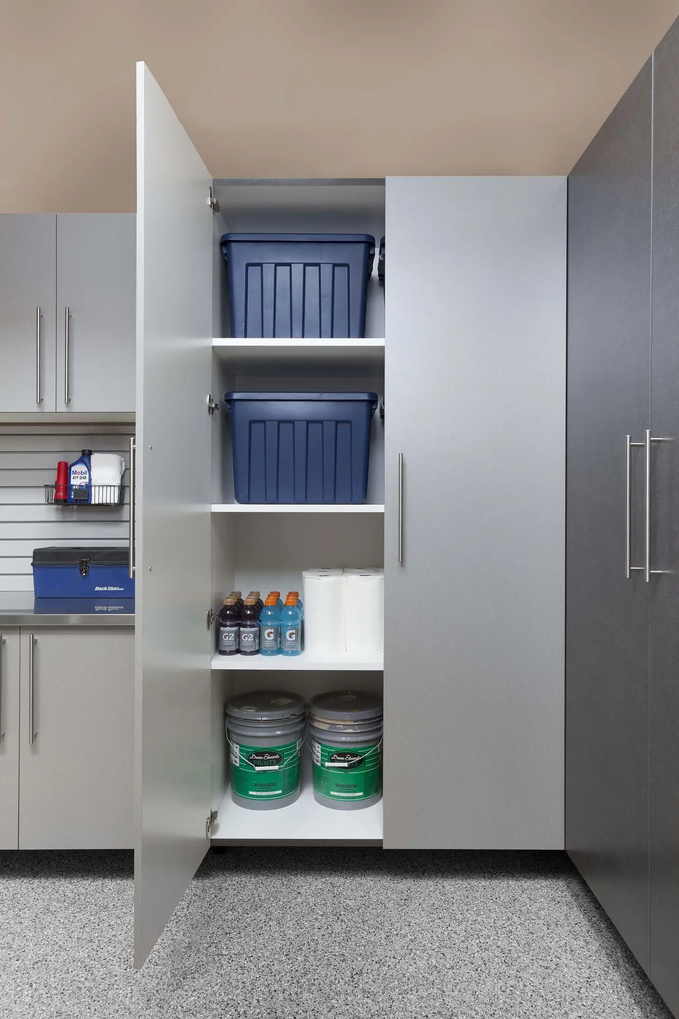 Silver garage workbench featuring a durable overhead storage design