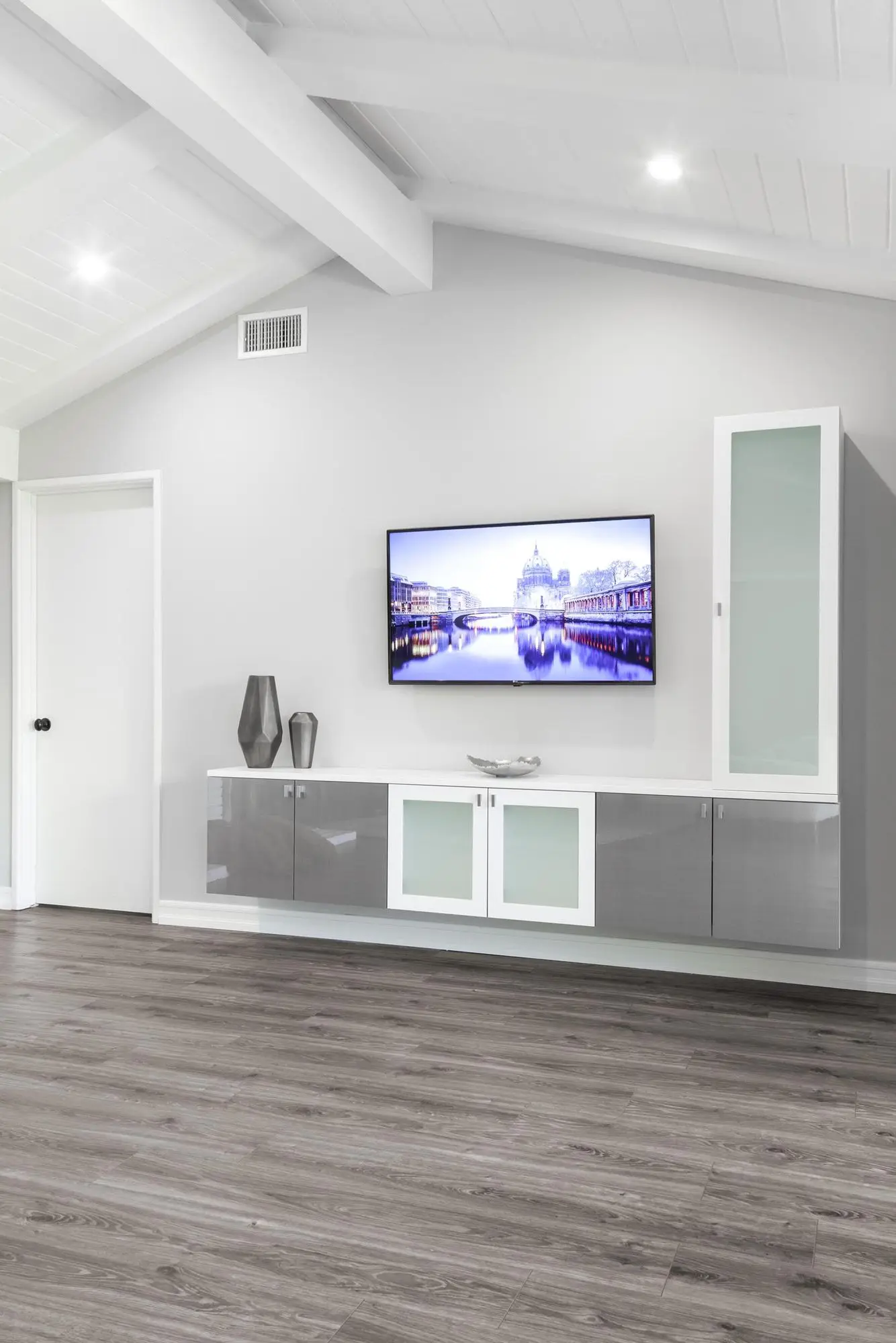 Bespoke modern TV wall unit and media organizer system maximizing family room storage