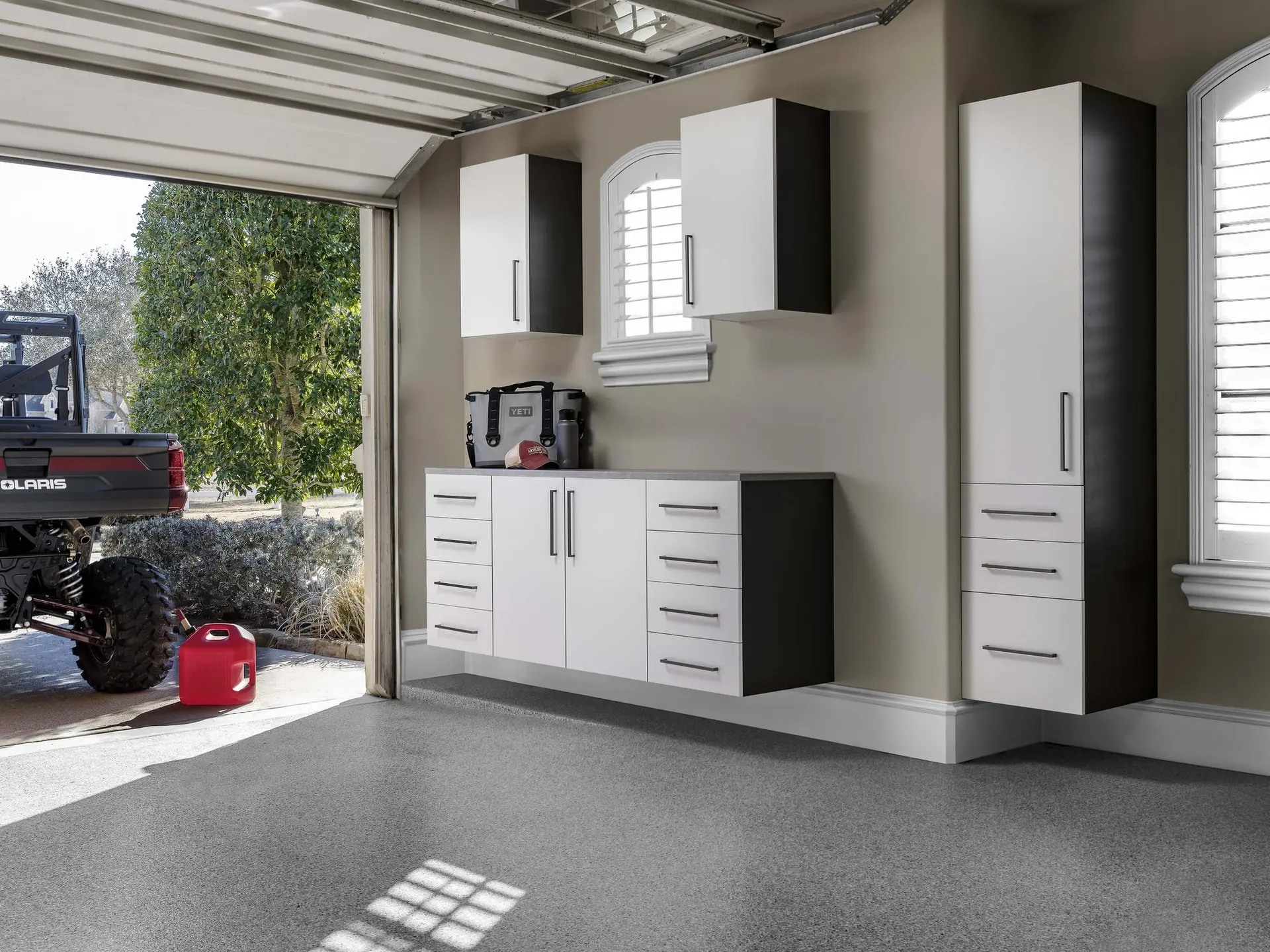 Premium custom white garage cabinets and matching drawer workbench system installed in Fort Lauderdale