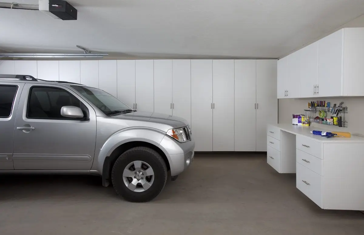 Sleek white garage storage systems and custom cabinets near me