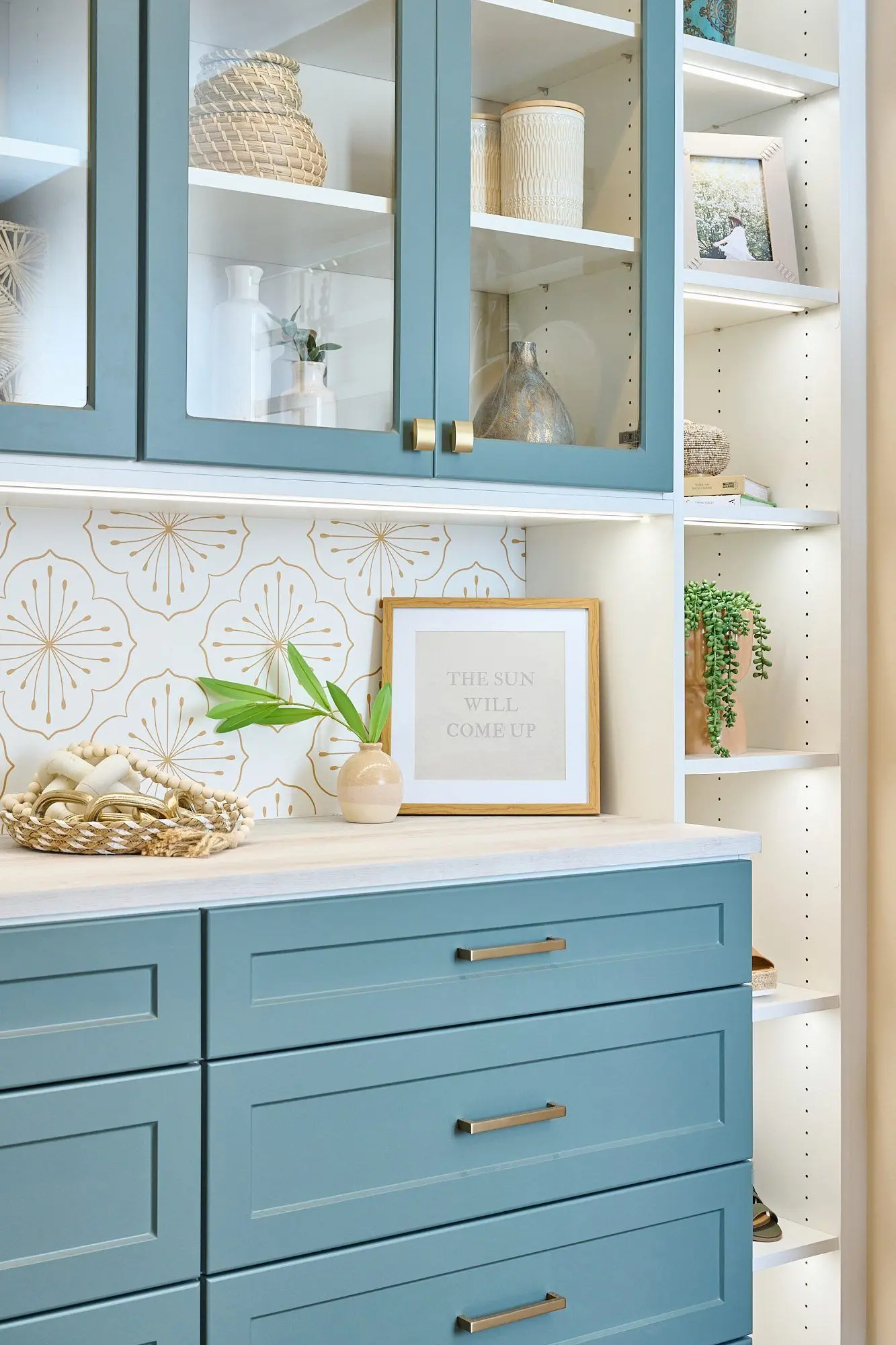 White and Lagoon two-tone closet organizer system featuring a custom vanity