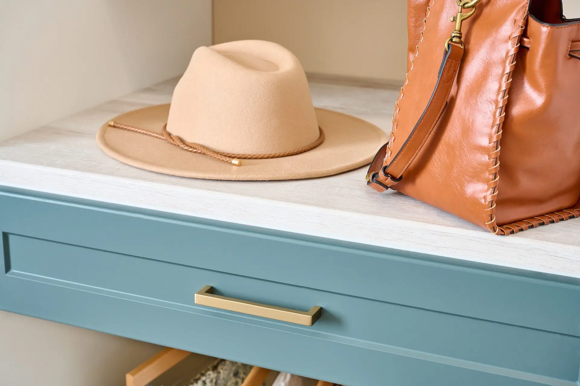 Sleek master suite boutique closet installation with integrated shoe cubbies