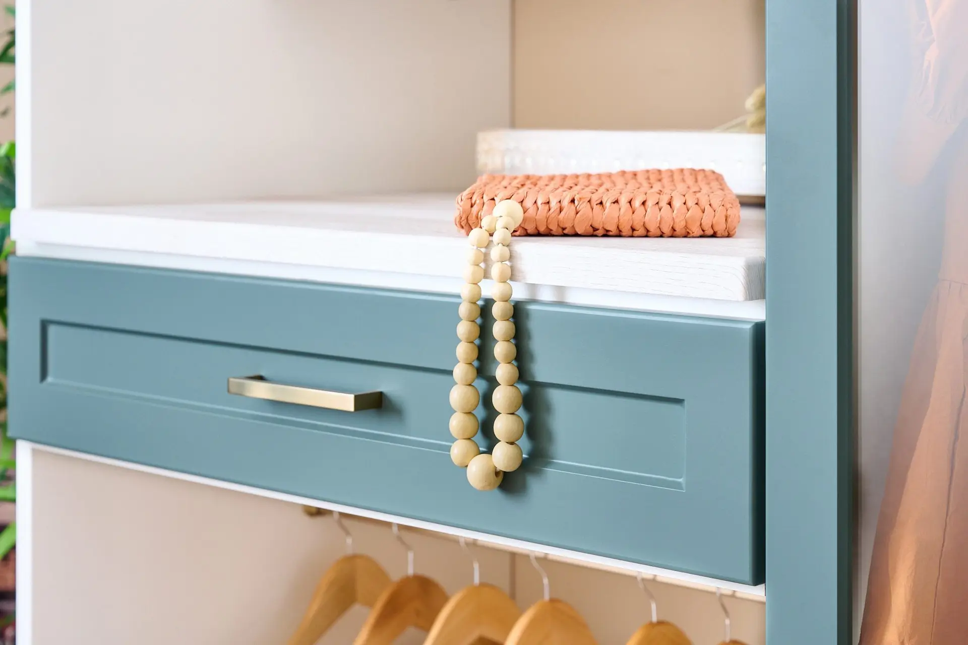 Sophisticated walk-in wardrobe configuration showcasing a clean two-tone finish