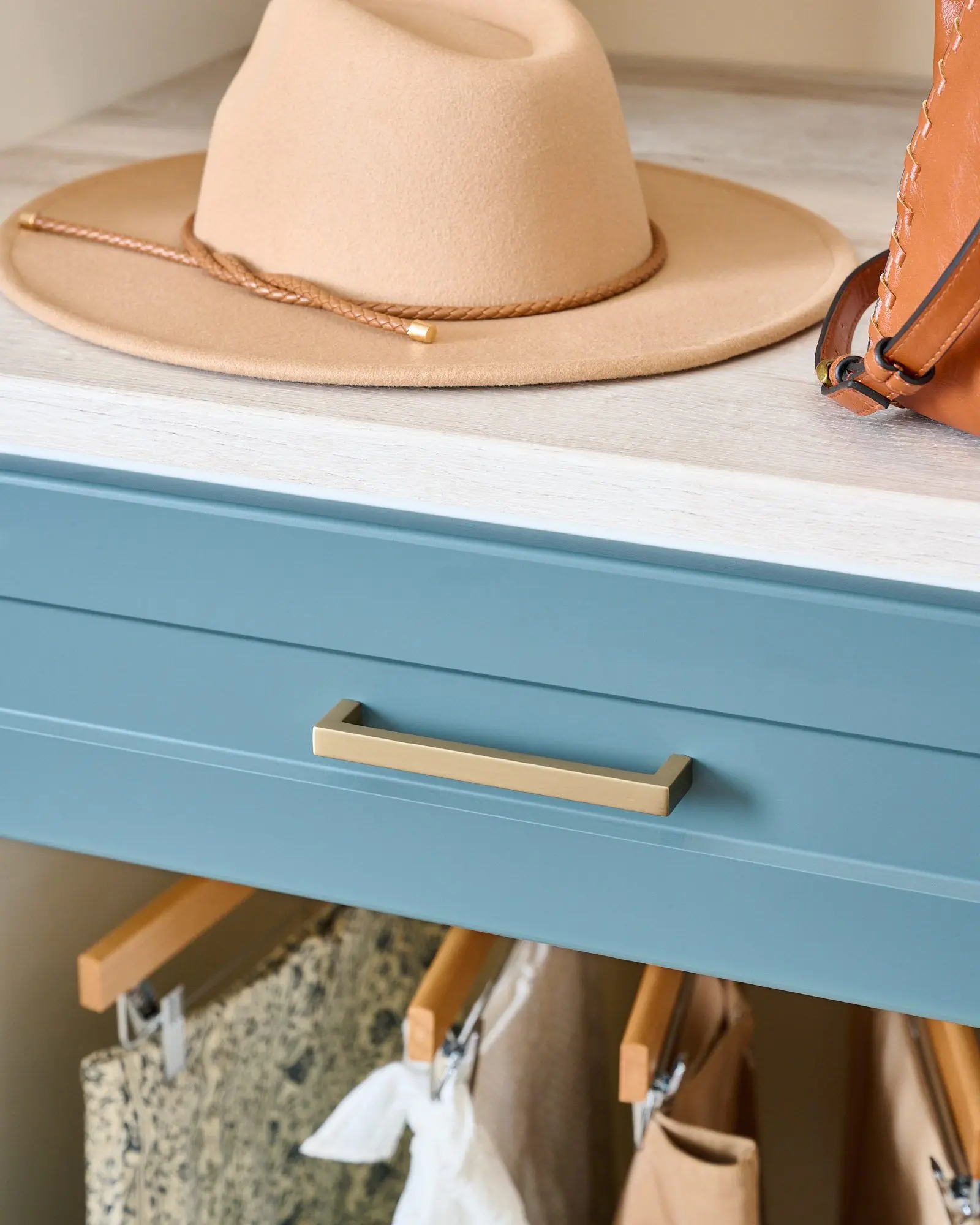 Bespoke boutique wardrobe closet layout showcasing elegant white cabinetry