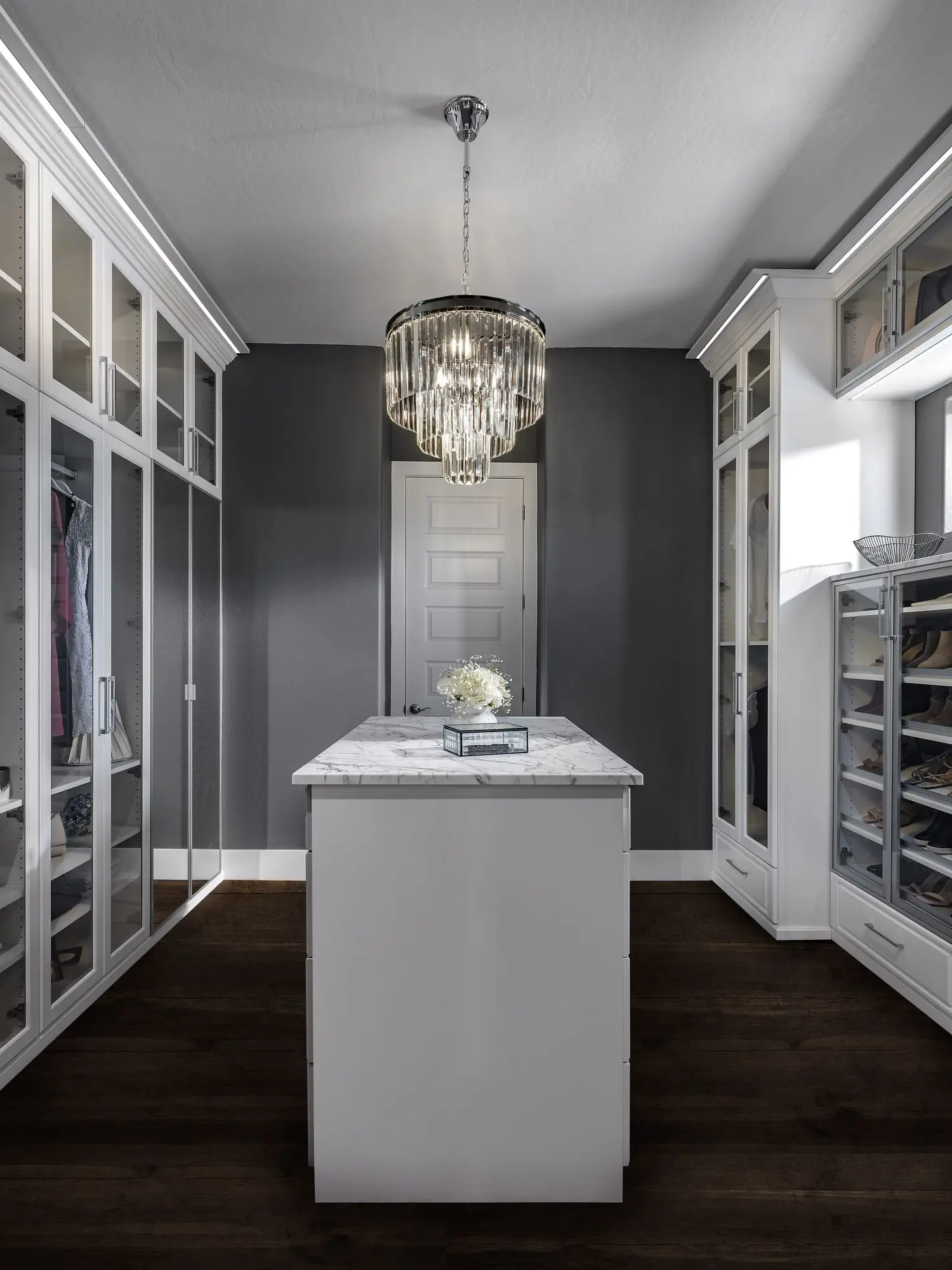 High-end custom closets Boca Raton FL installation with modern crown molding finishes