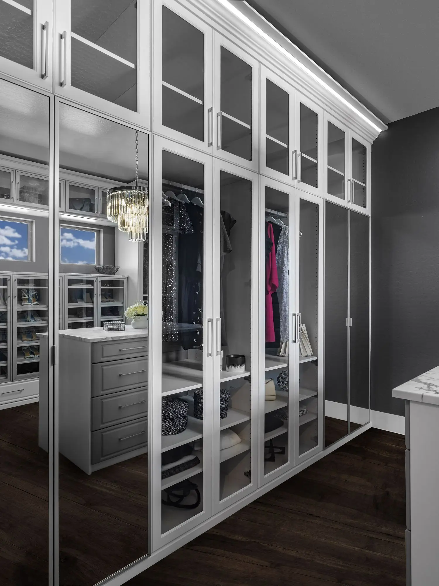 Bespoke boutique walk-in closet organizer system maximizing master suite apparel storage