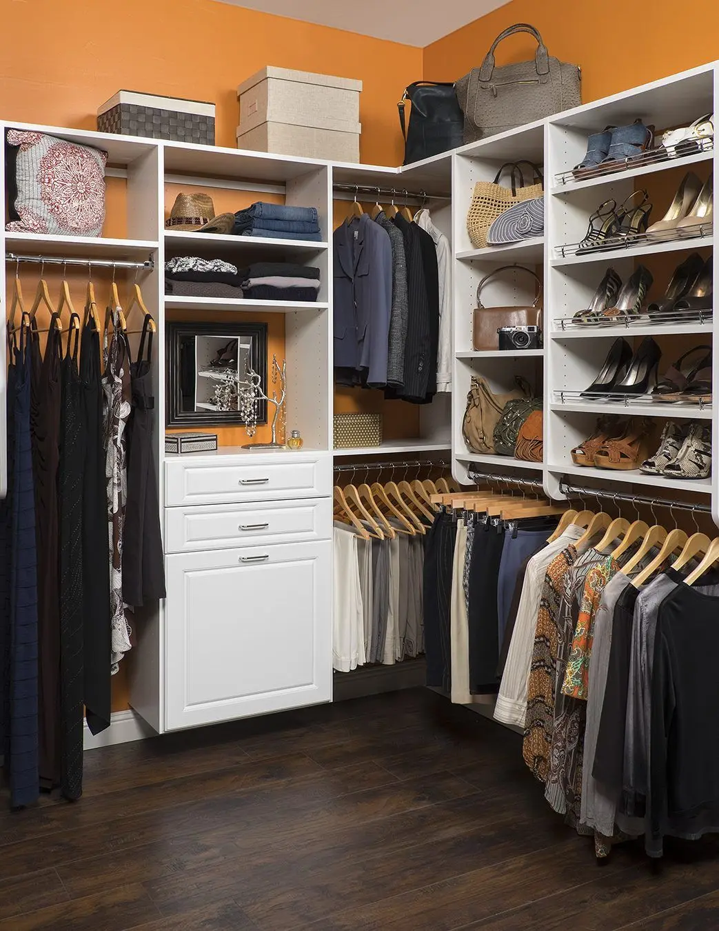 Spacious all-white wardrobe layout with built-in shoe racks and custom cabinetry